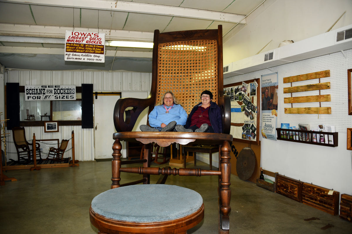 021 Linda Jaeger and Jill Ellis on Iowa's largest solid walnut rocker.JPG